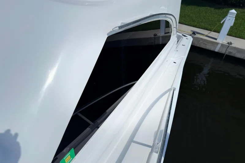 Slide: The Image of 2005 Luhrs 38 Convertible yacht, side view with sleek design and railing. - 19