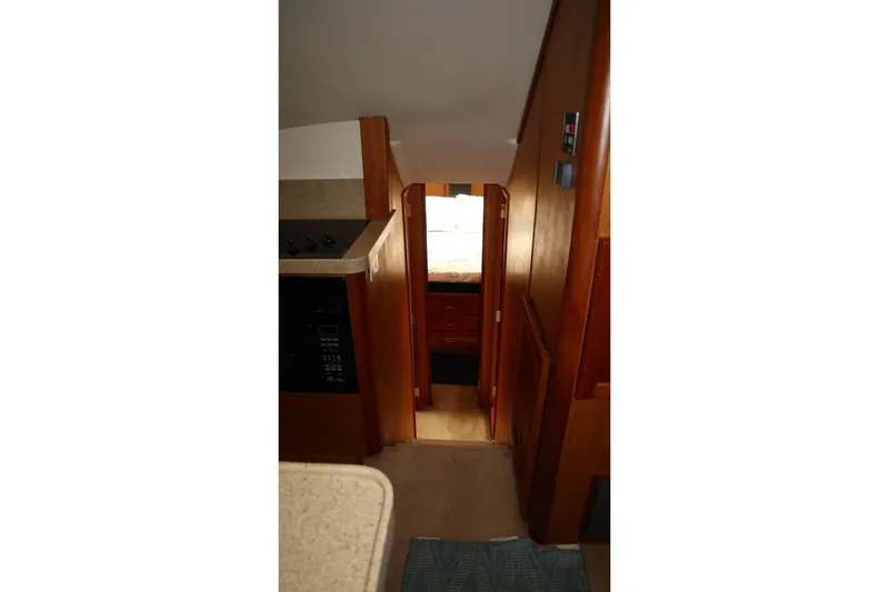 Slide: The Image of Interior view of 2005 Luhrs 38 Convertible yacht, featuring hallway and cabin entrance. - 33