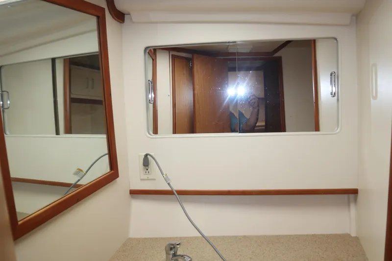 Slide: The Image of 2005 Luhrs 38 Convertible yacht bathroom with mirror and countertop. - 49