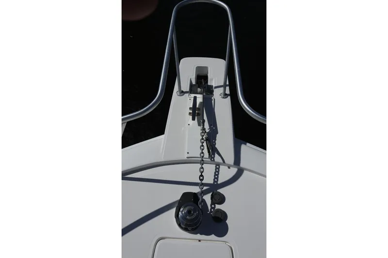 Slide: The Image of 2005 Luhrs 38 Convertible boat anchor system with chain and railing. - 58