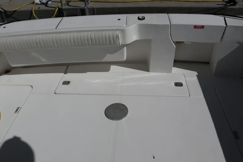 Slide: The Image of 2005 Luhrs 38 Convertible boat deck with seating and storage compartments. - 60