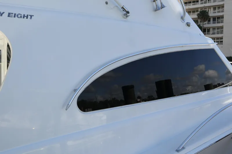 Slide: The Image of 2005 Luhrs 38 Convertible yacht with sleek window design and reflective surface. - 63