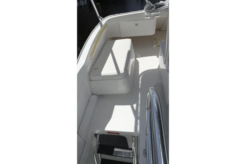 Slide: The Image of 2005 Luhrs 38 Convertible boat deck with seating and railing. - 66