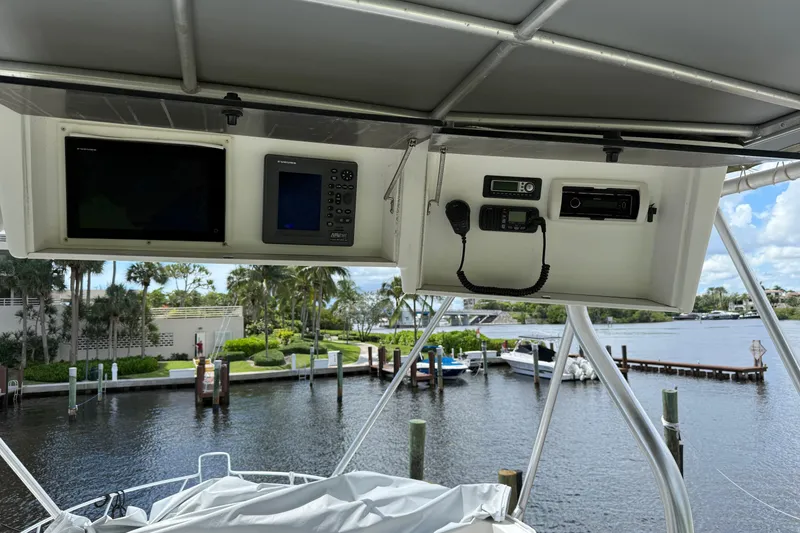 Slide: The Image of 2005 Luhrs 38 Convertible boat helm with navigation and communication equipment, dockside view. - 7