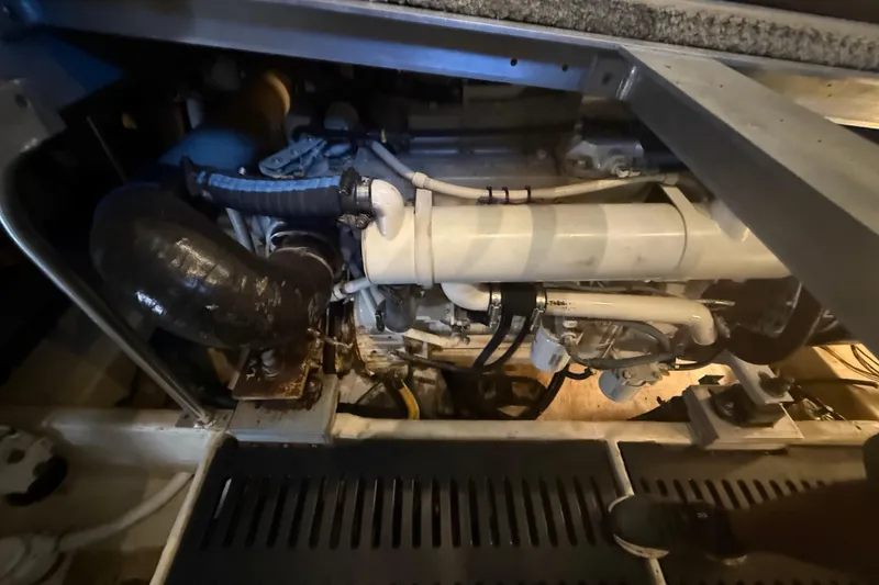 Slide: The Image of Engine compartment of a 2005 Luhrs 38 Convertible boat, showcasing mechanical components. - 72