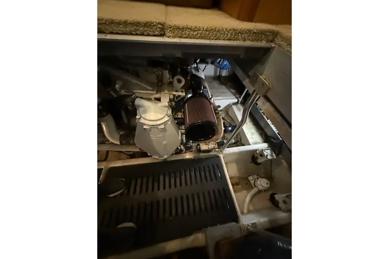 Slide: The Image of Engine compartment of 2005 Luhrs 38 Convertible boat, showcasing mechanical components. - 73