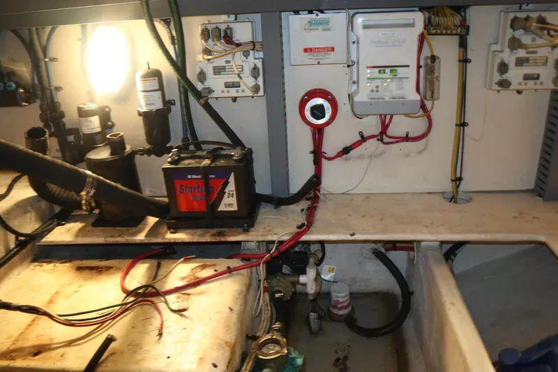 Slide: The Image of Engine room of 2005 Luhrs 38 Convertible with battery and electrical components. - 76