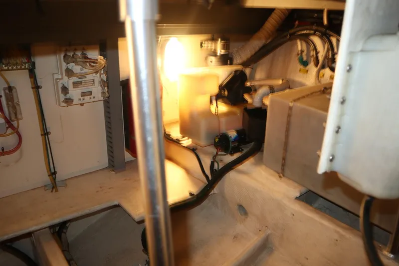 Slide: The Image of Engine room of 2005 Luhrs 38 Convertible boat, showing electrical and mechanical components. - 77