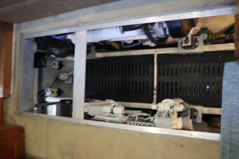 Slide: The Image of Engine compartment of 2005 Luhrs 38 Convertible boat, showcasing mechanical components. - 79