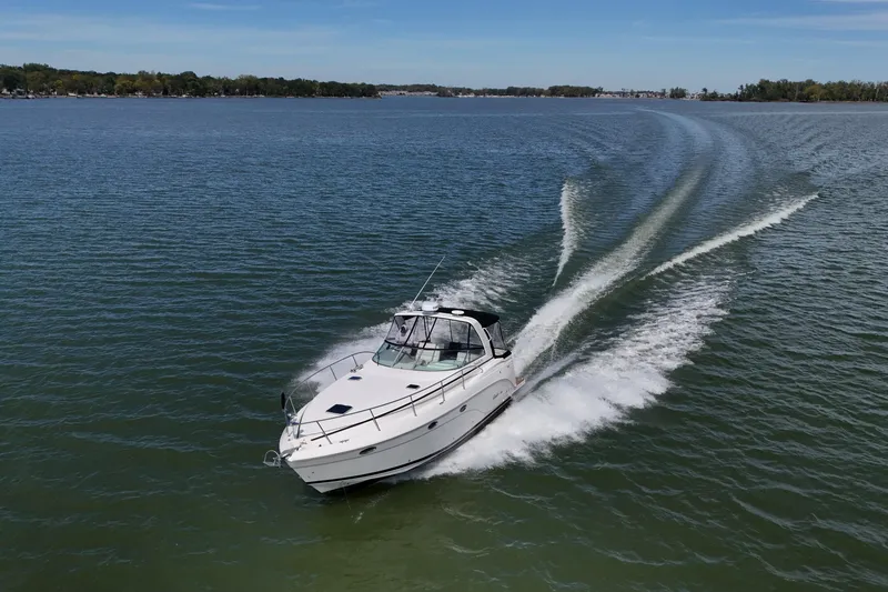 The Image of 2006 Rinker 360 Express Cruiser on calm water, side view. - 0