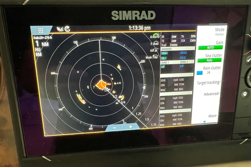 Slide: The Image of 2006 Rinker 360 Express Cruiser interior with "Lake Erie" pillow and map blanket. - 13