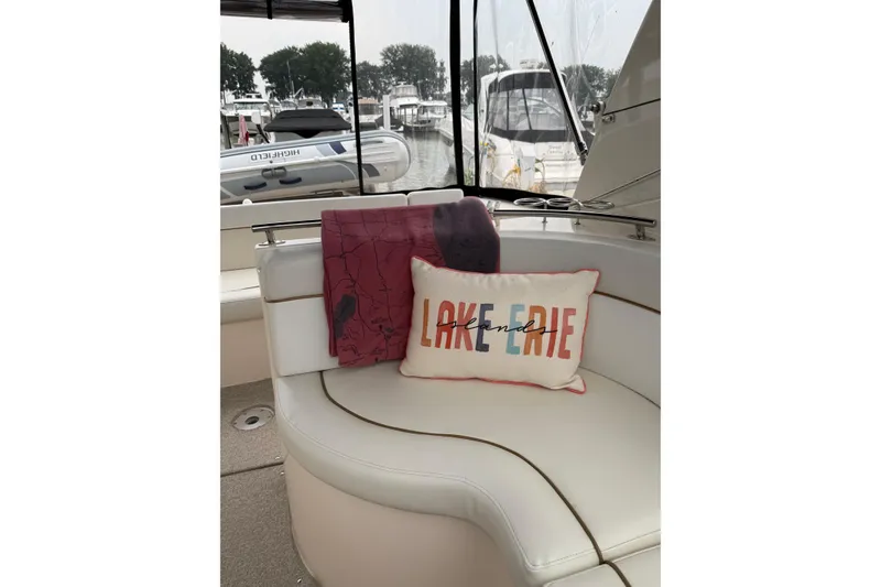 Slide: The Image of Interior of 2006 Rinker 360 Express Cruiser with kitchenette and dining area. - 15