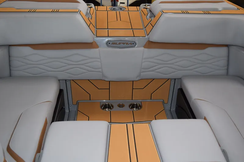 Slide: The Image of 2025 Supra SA boat interior with luxurious seating and modern design elements. - 11
