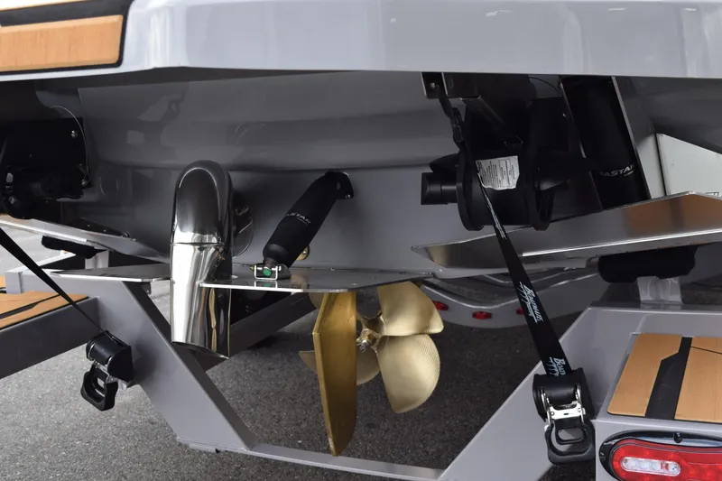Slide: The Image of 2025 Supra SA boat stern with propeller, exhaust, and trailer details. - 17