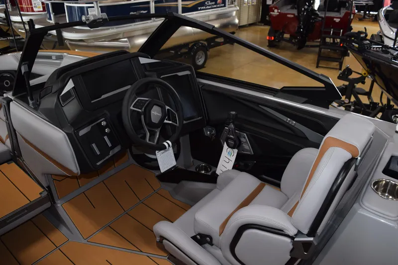 Slide: The Image of 2025 Supra SA boat interior with modern dashboard and steering wheel design. - 6