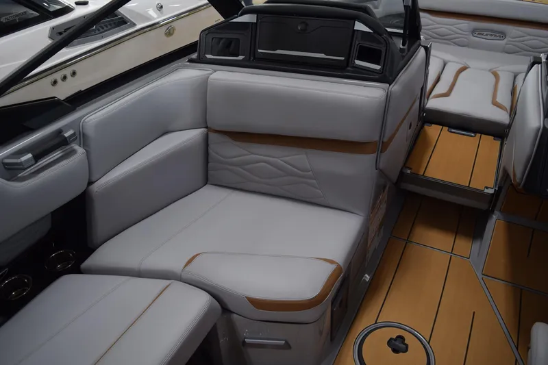 Slide: The Image of 2025 Supra SA boat interior with luxurious seating and stylish wood flooring. - 9