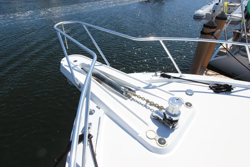 Slide: The Image of Bow of 2004 Hatteras 60 Convertible yacht with anchor chain and winch. - 11