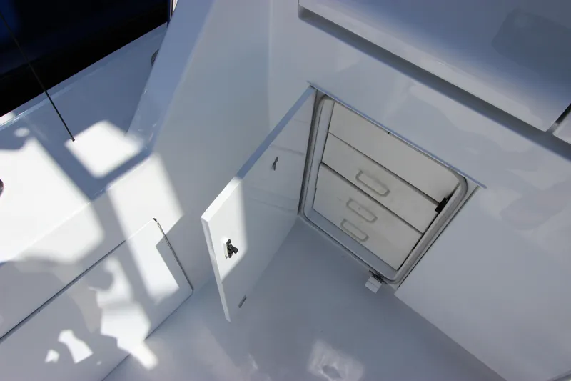 Slide: The Image of Open storage compartment on 2004 Hatteras 60 Convertible yacht deck. - 16