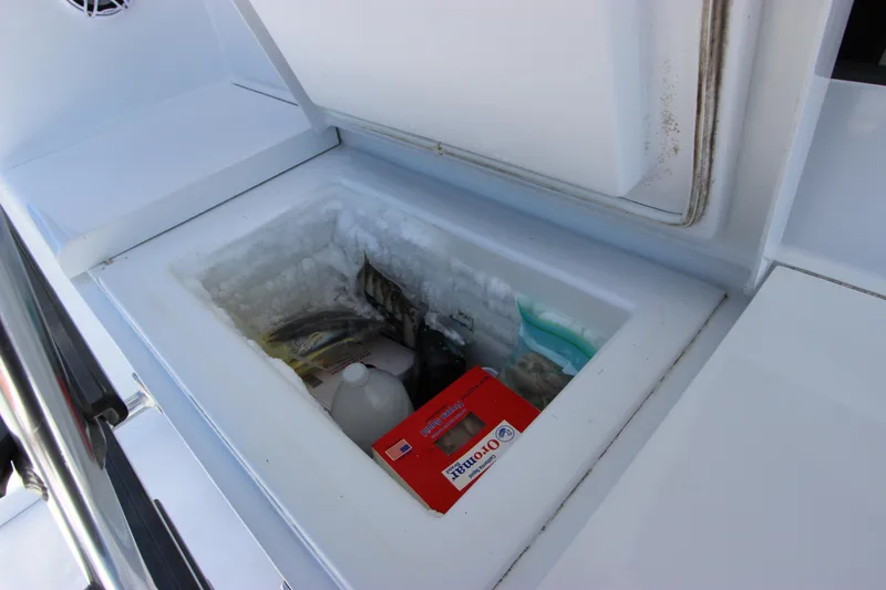 Slide: The Image of Built-in cooler on 2004 Hatteras 60 Convertible yacht, storing various items. - 18