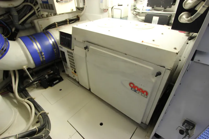 Slide: The Image of Engine room of 2004 Hatteras 60 Convertible yacht with Onan generator. - 24