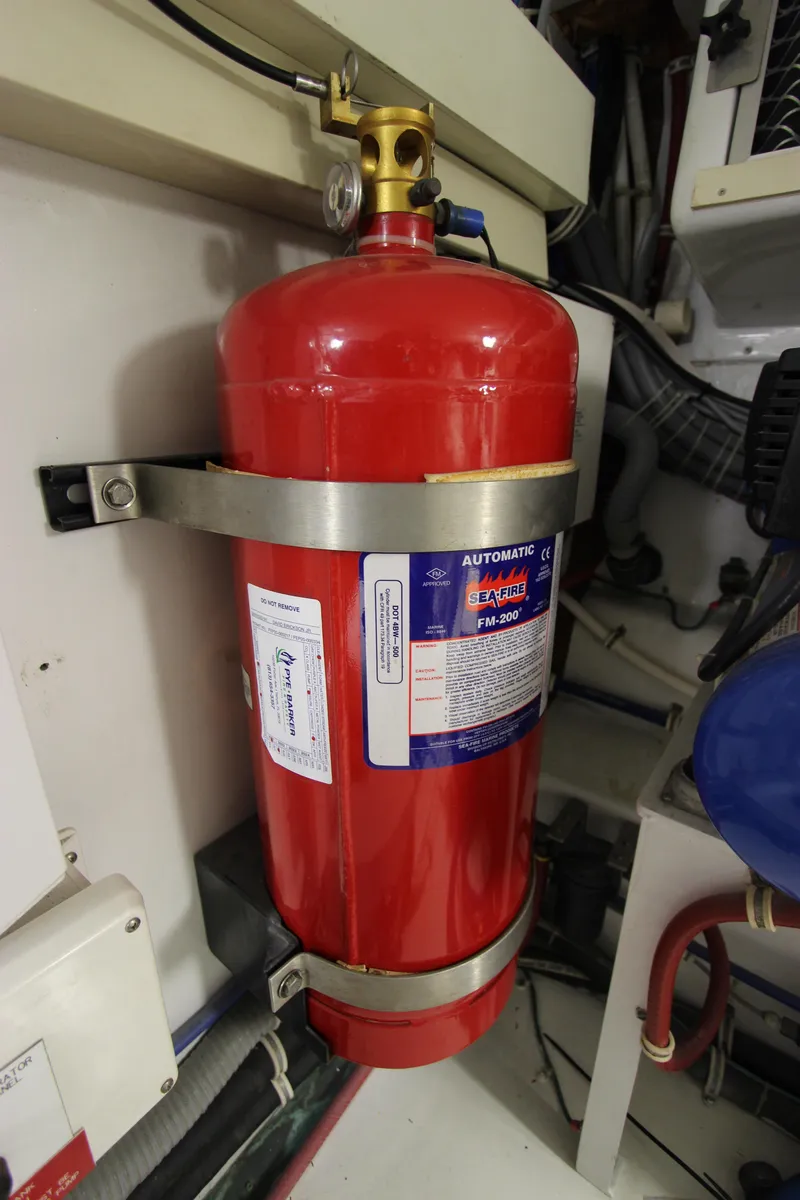 Slide: The Image of Red fire extinguisher in 2004 Hatteras 60 Convertible engine room. - 25