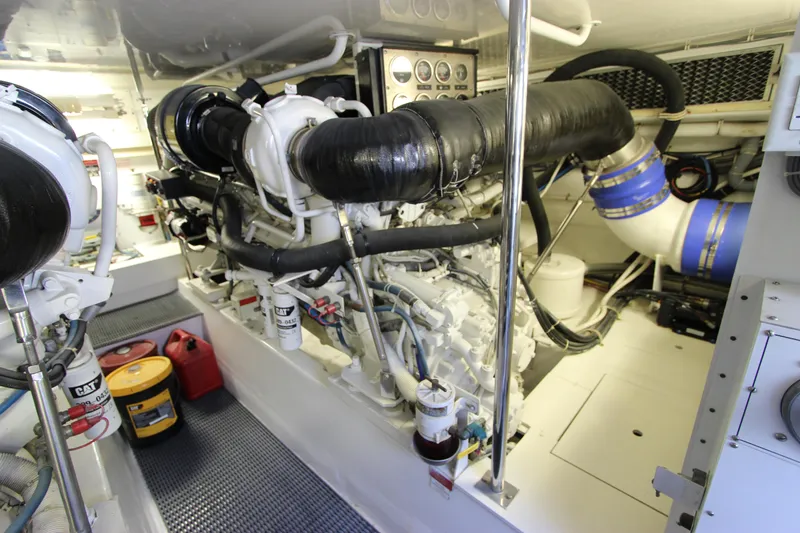 Slide: The Image of Engine room of 2004 Hatteras 60 Convertible yacht, showcasing machinery and components. - 30