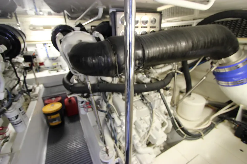 Slide: The Image of Engine room of 2004 Hatteras 60 Convertible yacht, showcasing machinery and components. - 31
