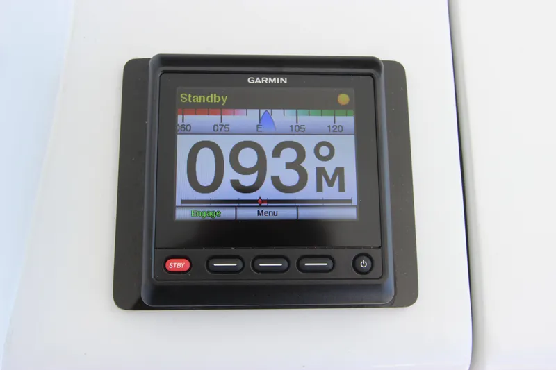 Slide: The Image of Garmin display on 2004 Hatteras 60 Convertible, showing heading 093M in standby mode. - 43