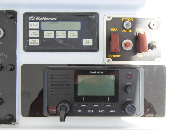 Slide: The Image of Control panel of a 2004 Hatteras 60 Convertible with Garmin navigation system. - 44