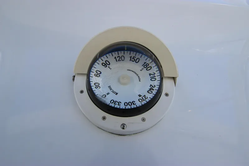 Slide: The Image of Compass on 2004 Hatteras 60 Convertible yacht, displaying directional degrees. - 46