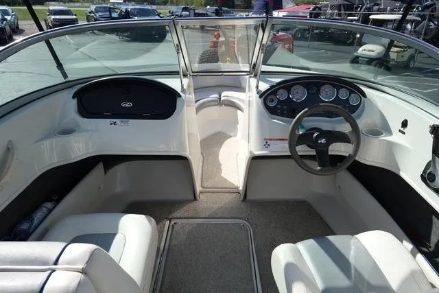 Slide: The Image of 2008 Sea Ray 175 Sport boat interior with steering wheel and dashboard controls. - 12