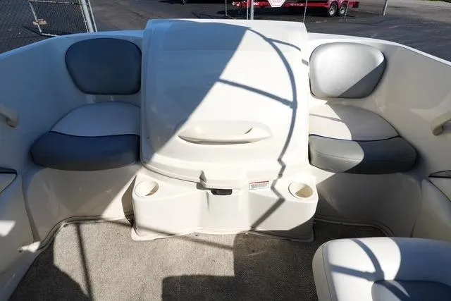Slide: The Image of 2008 Sea Ray 175 Sport boat interior with cushioned seating and cup holders. - 13