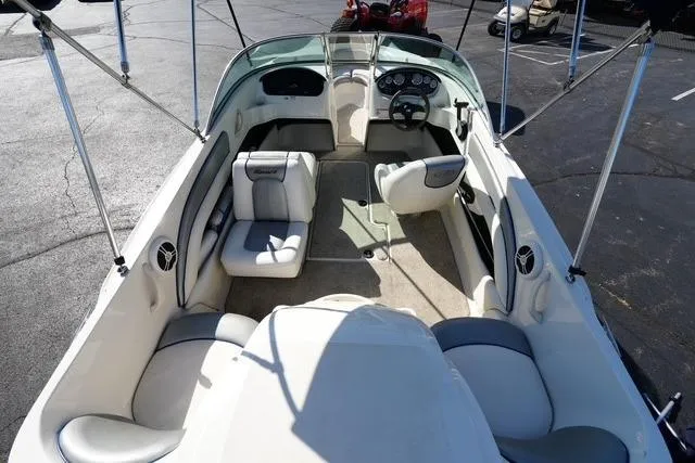 Slide: The Image of 2008 Sea Ray 175 Sport boat interior with seating and steering wheel. - 15