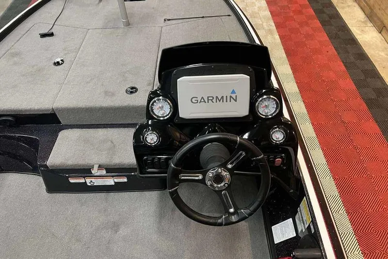 Slide: The Image of Steering console of a 2021 Nitro Z17 boat with Garmin display and gauges. - 2