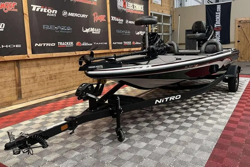 Slide: The Image of 2021 Nitro Z17 boat on trailer in showroom with branded backdrop. - 5