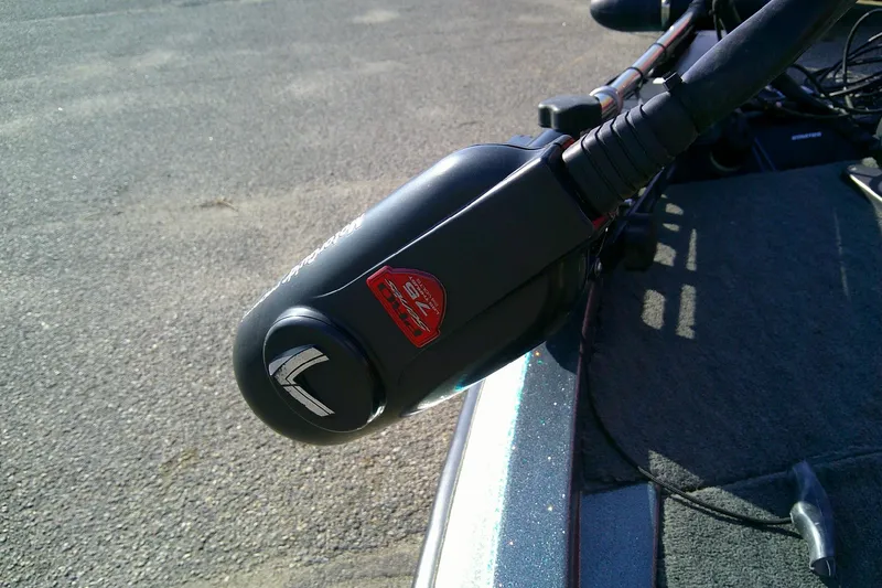 Slide: The Image of Close-up of a 1998 Stratos 273 V boat control handle on a textured surface. - 10