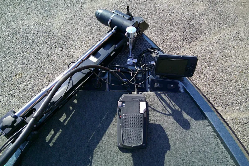 Slide: The Image of Bow of a 1998 Stratos 273 V boat with trolling motor and fish finder. - 19