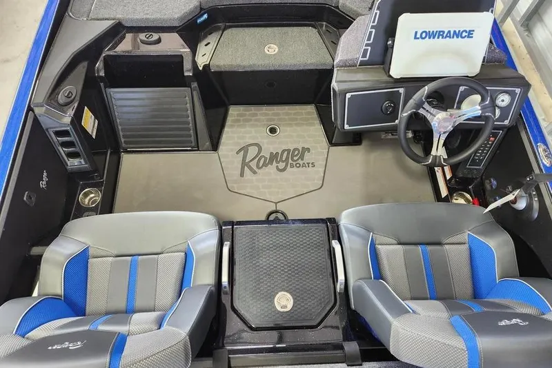 Slide: The Image of Interior of 2025 Ranger Z520 boat with steering wheel and seating. - 11
