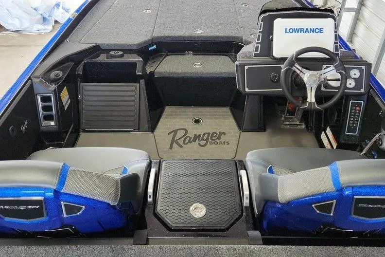 Slide: The Image of 2025 Ranger Z520 boat interior with Lowrance electronics and dual seats. - 3
