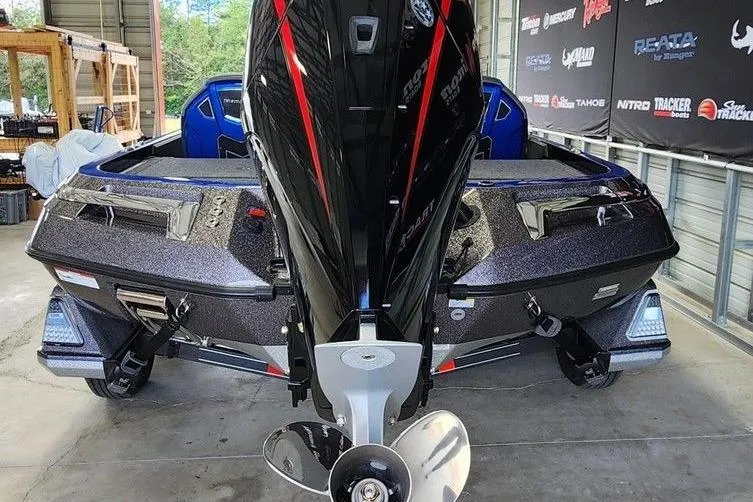 Slide: The Image of 2025 Ranger Z520 boat with powerful outboard motor in a garage setting. - 4