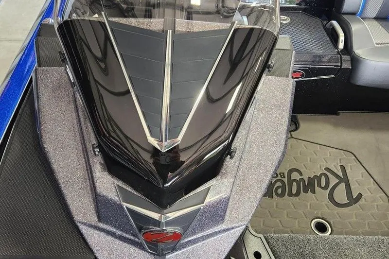 Slide: The Image of 2025 Ranger Z520 boat interior with sleek black console and branded floor mat. - 8