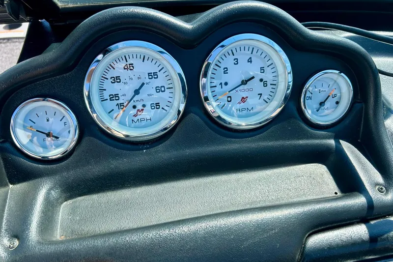 Slide: The Image of Dashboard gauges of 2021 Lund 1875 Crossover XS boat, showing speed, RPM, and fuel levels. - 10