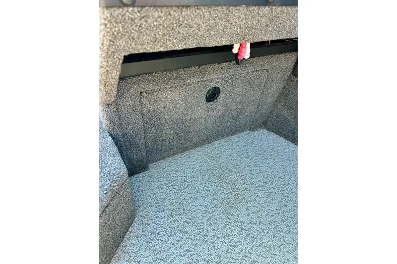 Slide: The Image of Interior view of 2021 Lund 1875 Crossover XS boat, featuring carpeted storage compartment. - 15
