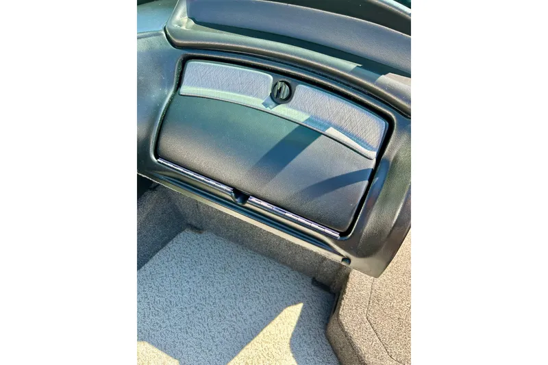 Slide: The Image of 2021 Lund 1875 Crossover XS boat interior with glove compartment detail. - 19