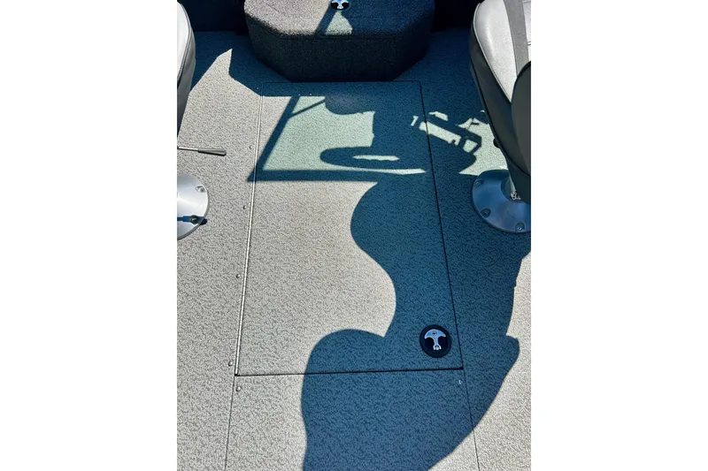 Slide: The Image of 2021 Lund 1875 Crossover XS boat interior with seating and storage compartment. - 30