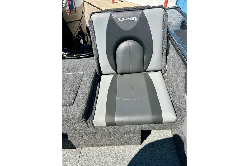 Slide: The Image of 2021 Lund 1875 Crossover XS boat seat, featuring gray and black upholstery. - 36