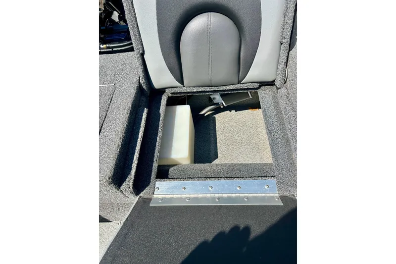 Slide: The Image of 2021 Lund 1875 Crossover XS interior storage compartment with gray upholstery. - 37