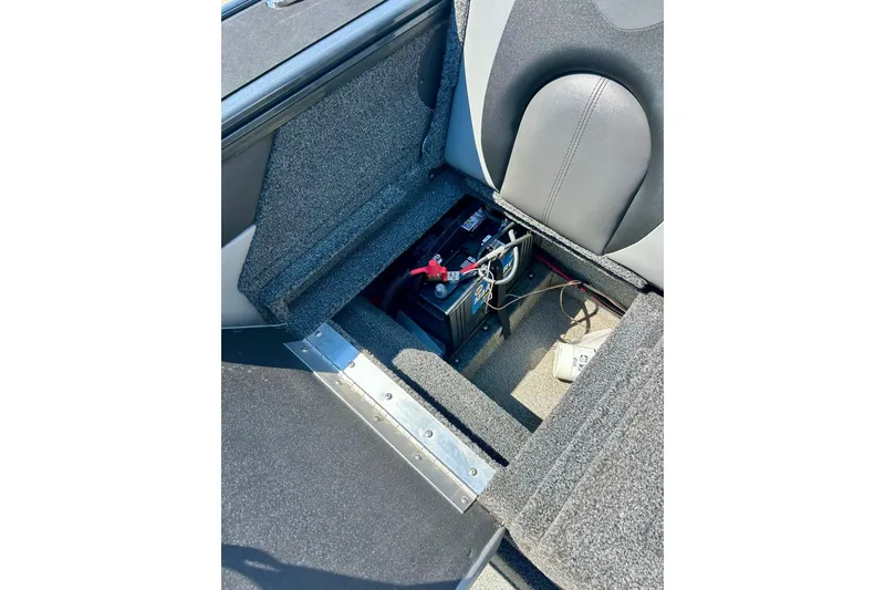 Slide: The Image of 2021 Lund 1875 Crossover XS boat interior showing battery compartment and seating. - 39