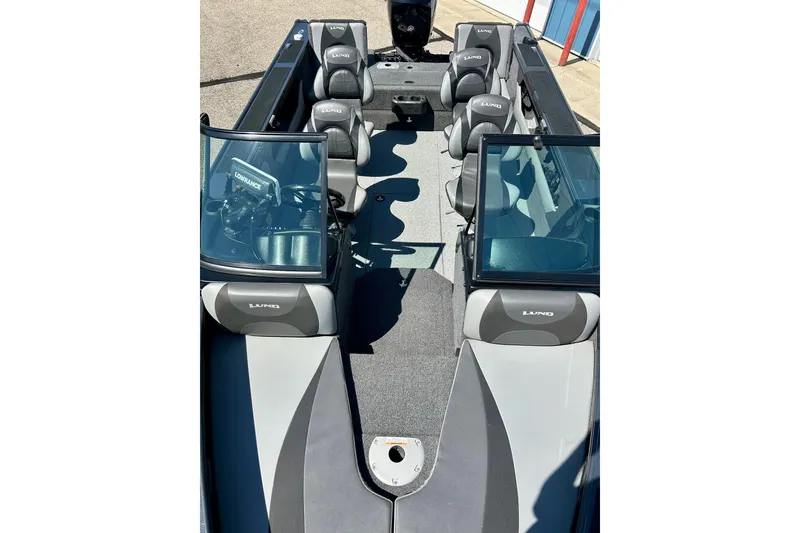 Slide: The Image of 2021 Lund 1875 Crossover XS boat interior with seating and navigation equipment. - 41