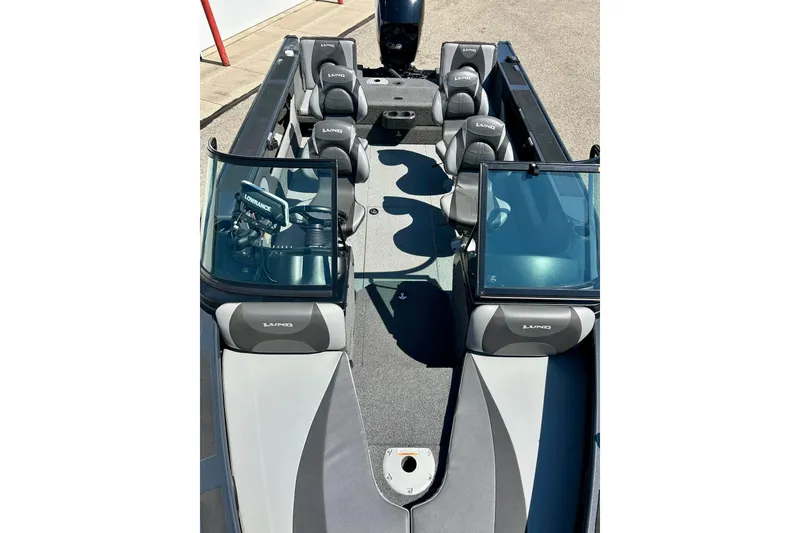 Slide: The Image of 2021 Lund 1875 Crossover XS boat interior with seating and windshield. - 57